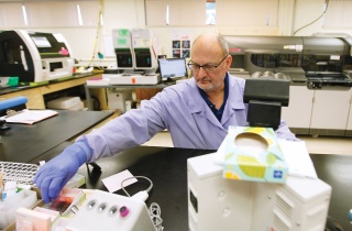 A laboratory technician works on samples at the Alice Hyde Medical Center Laboratory.