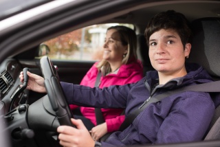 Patient and provider sit inside a car during a Driver Rehabilitation session at UVM Medical Center.