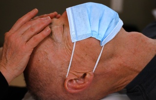 A patient gets reiki at the University of Vermont Medical Center's Comprehensive Pain Program.