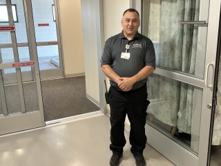 Bill Allen stands in hallway of Elizabethtown Community Hospital-Ticonderoga.