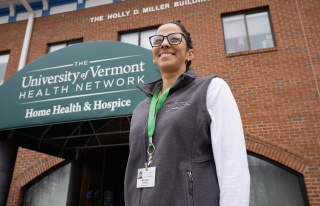 Portrait of Melinda Hess standing in front of Home Health & Hospice's offices.