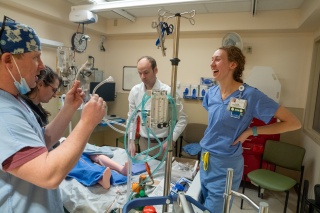 UVM Medical Center Chief Perfusionist Paul Hunter (far left) works a simulation with physicians Katelin Morrisette (left), Skyler Lentz (center) and critical care nurse Alicia Imbergamo (right).