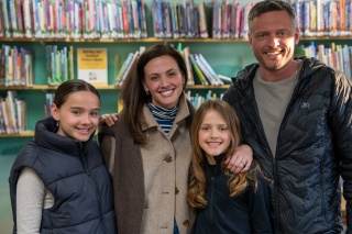 The Andrews family poses for a photo at the local library.