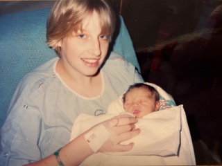 Cindy Evans holding her newborn daughter in the hospital.