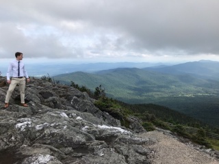 Diagnostic Radiology Faculty William Parkinson standing at top of mountain