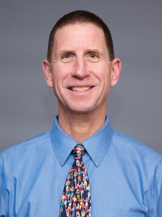 Headshot of Scott Paluska, MD, a Sports Medicine Physician.