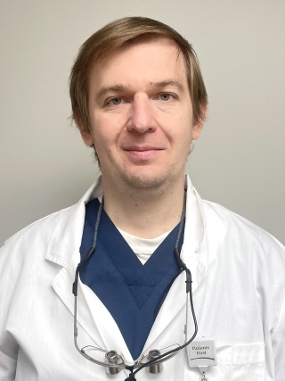 Headshot of Andrii Shykota, DMD, a Dentist.