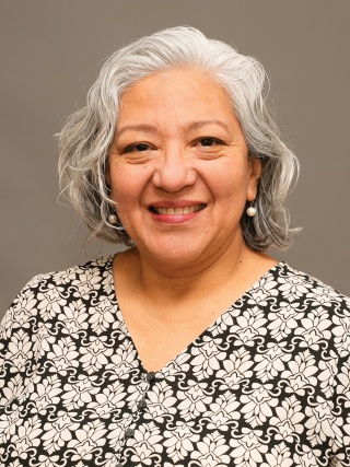 Headshot of Isaura Menzies, MD, a Geriatric and Adult Primary Care Internal Medicine Physician.
