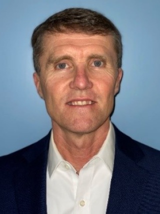 Portrait of Dominic Eisinger.