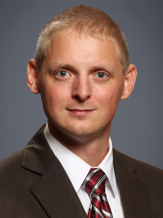Headshot of Justin M. Stinnett-Donnelly, MD.
