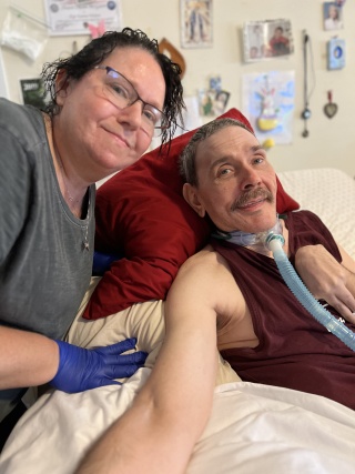Kelly McGuire (left) and her brother, Shaun McGuire, pose for a photo at their home in South Burlington, Vermont.