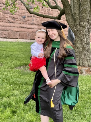 Megan Prue, MD, with her daughter at her graduation from medical school.