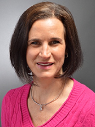 Headshot of Lisa Carey, MS, CCC-SLP.