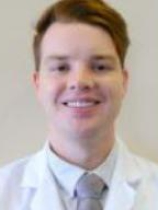 Headshot of Dylan Adams