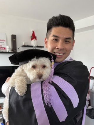 Eric Wu, DMD holding his dog