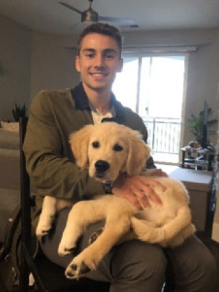 Jacob Catinella, DMD holding his dog