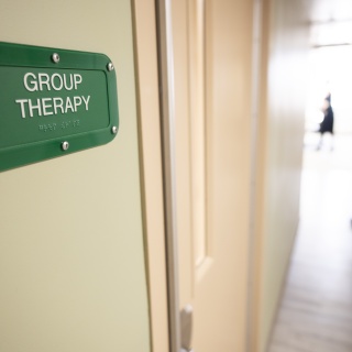 Close-up photo of a group therapy sign.