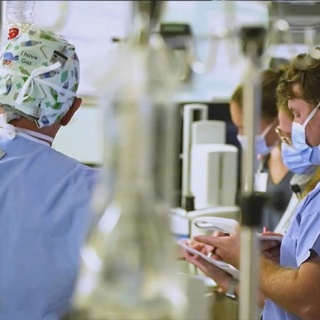Fellows taking notes during procedure