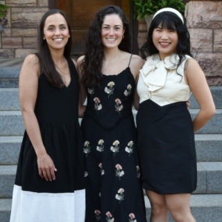 Group photo of three female OBGYN residents standing outdoors.
